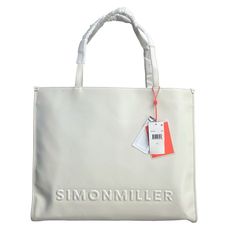 Simon Miller Logo Studio Tote In White New With Tag Be Fashionable And Stylish With This Branded Vegan Leather Large Logo Tote Bag With Long Straps And Metal Closures! Includes An Interior Pocket. The Long Straps Make It Easy And Comfortable To Carry, While The Metal Closures And Interior Pocket Keep Your Belongings Secure. Front Embossed Logo Imported Sizing - Height: 37cm - Length: 44cm - Depth: 3cm - Strap Drop: 10.5cm Fit Tip Fits True To Size. Fabric / Material 65% Pu 35% Fabric White Travel Shoulder Bag With Embossed Logo, White Shoulder Bag With Embossed Logo For Travel, Classic White Bags With Embossed Logo, Elegant White Bag With Embossed Logo, Logo Tote Bag, Simon Miller, Embossed Logo, Womens Tote Bags, Fabric Material