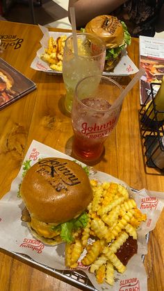 there is a hamburger and fries on the table