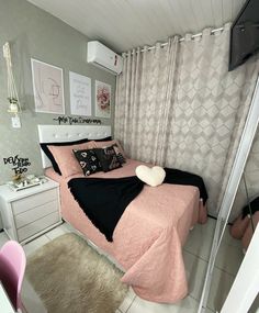 a bed room with a neatly made bed