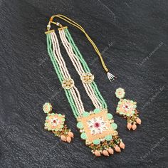 This is a stunning handmade necklace perfect for high end Jewelry Collector, a keeper in Traditional Vintage Indian/Pakistani Bridal jewelry and a Luxury Gift for your Daughter, Sister or Wife on Wedding or Anniversary. Perfect for any type of occasions, weddings And celebrations and a beautiful & memorable gift for weddings and special occasions. - Item Code:- L -Aqua green & peach beaded Necklace Set with Earrings. -Designer multi layered faceted peach & green beaded necklace. -Gold Plated Set with Kundan Stones which shine like Polki Diamonds. -Metal: Gold plated brass -Earrings are 95mm long & 45mm wide approx -Push Back Earrings -Necklace length with pendant 11.5" approx including adjustable dori/cord -Quantity - One Necklace Set Please see more different designs here:- https://www.et Luxury Meenakari Bridal Necklace Pendant, Luxury Meenakari Beaded Bridal Necklace, Luxury Bridal Meenakari Pendant Necklace, Luxury Meenakari Pendant Bridal Necklace, Pakistani Bridal Jewelry, Kundan Necklace Set, Vert Turquoise, Green Beaded Necklace, Polki Necklace