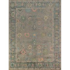 an antique rug with many different colors and designs on the border, in grey tones