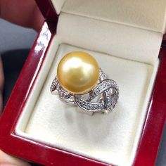 GOLDEN SOUTH SEA PEARL, absolutely natural color and luster, 14.5 mm in size, surrounded by 54 pieces of hand-set F/VS superb quality diamonds, weighting at 1.17 carats. Set in handcrafted, one of a kind 18K solid white gold ring, weighting at 13.5 grams. The pearl is naturally cultured from South Australia Sea, its luster is EXTREMELY fine, AA+ grade with 90% clean surface. SUGGESTED RETAIL PRICE: $8,800 The ring is hand crafted to a high standard and is NOT mass machine produced and is brand n Elegant Yellow Diamond Ring Hallmarked, Elegant Yellow Diamond Ring, Diamond Pearl Ring With High Luster For Gift, Gift Pearl Ring With High Luster And Diamond, Golden South Sea Pearls, Gold For Sale, Vs Diamond, Sea Pearl, South Sea Pearls