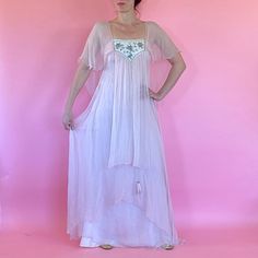 "1970s Pink Chiffon Ethereal dress by Shuji Tojo made in England. Made of Pink Silk Chiffon with Cream Colored Lining with Silver Beaded and Sequins Yolk and a Feather Tassel. A Off Shoulder Design with Flowing Layers of Chiffon, she is a Ethereal Dream.  Size: Small-Medium Bust: 32\" Waist and Hips: 40\" Length: 62\" Condition: Good - Great Fabric is in Great Condition, Strong and Sturdy.  Small Hole Found at Hem and a Few Faint Spots. Please Message me any questions before Purchasing as this I 1970s Style Summer Evening Maxi Dress, 1970s Style Maxi Dress For Summer Evening, Vintage Silk Chiffon Summer Dress, Vintage Silk Chiffon Dress For Summer, Vintage Sheer Chiffon Dress, Bohemian Silk Dress With Sheer Details, Bohemian Silk Sheer Dress, Bohemian Sheer Silk Dress, 1970s Style Summer Floor-length Dresses