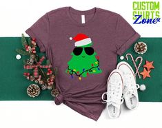 🎄Funny Christmas Tree Shirt, Tree with Christmas Light and Sunglasses, Christmas Gift for Kids, Matching Christmas Tee, Holiday Gift Shirt  🎁 Enjoy your shopping ! Need custom made shirts? Don't hesitate to message us! Thanks for your support! CustomShirtsZone_ Family ----- How To Order ----- 1-) Please, check and review all the photos. 2-) Choose your t-shirt size and color. *Different styles of shirts may have different shades of same color choice due to different manufacturer brands. *For this reason, we recommend you to match shirts from the same styles if you want precisely matching colors (ex. Unisex, V-necks, Toddler, etc.). 3-) Click add to cart. You can go back to add more shirts. 4-)Click "Proceed to check out". 5-)When you check out, you can add a note to seller for any reques Funny Christmas Tree, Christmas Gift For Kids, Custom Made Shirts, Christmas Tree Shirt, Tree Shirt, Matching Colors, Christmas Light, Christmas Tees, Gift For Kids