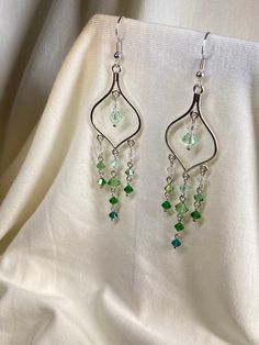 Stand out with these beautiful crystal earrings! Made with genuine Swarovski beads, they have a shine unlike any other bead. Wear to a formal event or with jeans and a T-shirt to jazz up any outfit. Long Beaded Earrings, Earrings Fancy, Earrings Prom, Beaded Chandelier Earrings, Green Gradient, Prom Earrings, Fancy Earrings, Swarovski Beads, Earrings Crystal