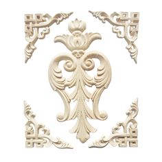 an intricately carved wall panel in white