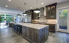 a large kitchen with an island and lots of counter space