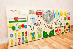 a child's play room with wooden pegs and magnets on the wall