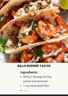 three shrimp tacos on a plate with lime wedges