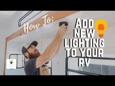 a man is working on the light fixture in his rv's living room with text overlay that reads how to add new lighting to your rv