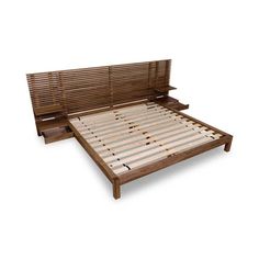 a wooden bed frame with slatted headboard and foot board on the bottom