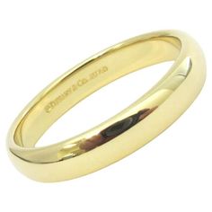 TIFFANY & Co. Forever 18K Gold 4.5mm Lucida Wedding Band Ring 12 Metal: 18K Yellow Gold Size: 12 Band Width: 4.5mm Weight: 7.70 grams Hallmark: ©TIFFANY&Co. AU750 Condition: Excellent condition, like new Tiffany price: $1,460 Authenticity Guaranteed Gold Cartier Ring Tiffany & Co., Tiffany Setting, Modern Wedding Rings, Tiffany Diamond, Aquamarine Necklace, Gilded Age, Art Nouveau Jewelry, Platinum Engagement Rings, Modern Ring