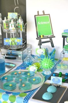 a science themed party with blue and green decorations