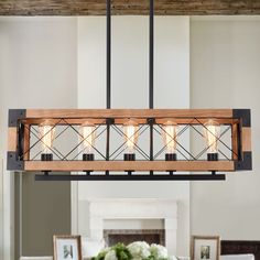 a light fixture hanging over a dining room table