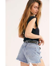 RESTOCKED-BESTSELLER! So cool and slouchy, these vintage-inspired denim shorts are featured in a distressed cotton fabrication and high-rise silhouette with exaggerated inseam for longer shape. Care/Import Machine Wash Cold Import Measurements for size 28 Waist: 31.5 in Hips: 39.5 in Rise: 12 in Inseam: 4 in Short Twists, Twist And Shout, Free People Clothing, Vintage Shorts, Cut Off Shorts, Bike Shorts, Cut Off, This Summer, Jean Shorts