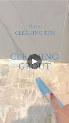 a person holding a toothbrush in front of a box with cleaning tips on it