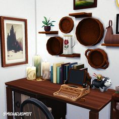 a computer desk topped with lots of wooden plates and bowls next to a wall covered in pictures