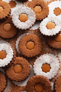 some cookies with icing and powdered sugar on them