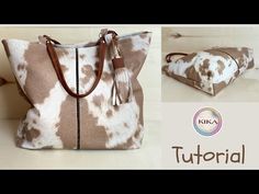 a brown and white cow print tote bag with tassels on the handles