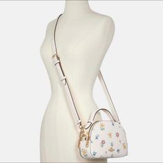 New With Tag! Authentic Coach Serena Satchel With Wild Meadow Print Chalk: Crossbody Bag Come With Original Package From Coach Refined Pebbled Leather Inside Multifunction Pocket Double Zip Closure, Fabric Lining Handle With 2" Drop Outside Slip Pocket Detachable Strap With 21" Drop For Shoulder Or Crossbody Wear 8 1/4" (L) X 5 3/4" (H) X 2 1/2" (W) Ship Next Day! Coach Serena Satchel, Coach Bags With Detachable Handle For Spring, Casual White Bag With Floral Print, Casual White Floral Print Bag, Coach Top Handle Bag For Spring, Spring Coach Top Handle Bag, Spring Floral Print Cream Bags, Coach Floral Print Bags For Everyday Use, Coach Bags For Daily Use In Summer