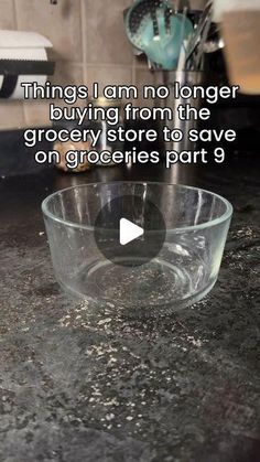 a glass bowl sitting on top of a kitchen counter next to a sink with the words, things i am no longer buying from the grocery store to save on groceries part 9