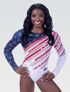 a woman in a bodysuit that has the american flag on it and is standing with her hands on her hips