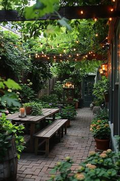 Lush garden patio with string lights, wooden tables, and benches. Surrounded by greenery and potted plants, creating a cozy and inviting atmosphere. Architectural Digest Backyard, Aesthetic Back Garden, Backyard Garden Dining Area, Rainy Patio Ideas, Backyard Mini Garden, Small Backyard Covered Patio Ideas, Small Backyard Herb Garden, Cottage Garden Sitting Area, Mini Backyard Garden