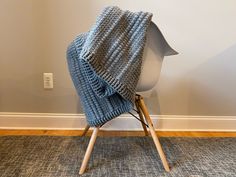 a chair with a knitted blanket on it