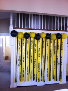 there are many yellow caution signs on the shelf