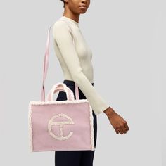 Nwt Ugg X Telfar Crossbody Bag Pink Suede Graphic Print Silver-Tone Hardware Shearling Trim Flat Handles & Dual Shoulder Straps Twill Lining & Single Interior Pocket Snap Closure At Top Includes Dust Bag Details Estimated Item Measurements Shoulder Strap Drop: 20.5" Handle Drop: 4.5" Height: 12" Width: 15" Depth: 4.5" H 14 Pink Shopping Bag, Telfar Bags, Pink Shopping, Bag Details, Pink Suede, Womens Uggs, Pink Bag, Womens Tote Bags, Snap Closure