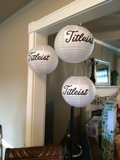 three white paper lanterns with the words titleia, titleist, and title written on them