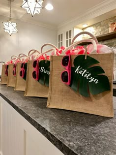 bags with sunglasses are lined up on the counter