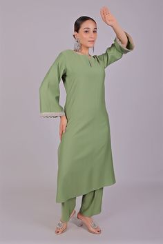 Bluesaanchi Women's Light Green Kurti Pajama Set  The Bluesaanchi Women's Light Green Kurti Pajama Set is a perfect blend of elegance and comfort. This beautifully designed set features a light green kurti paired with matching pajamas, making it an ideal choice for casual outings and festive occasions. The intricate detailing and comfortable fit make this set a must-have addition to your wardrobe.  Key Features  Stylish and elegant design  Comfortable fabric for all-day wear  Perfect for casual and festive occasions  Available in various sizes   Specifications  Brand: Bluesaanchi  Color: Light Green  Set Includes: Kurti and Pajama  Available Sizes: S, M, L, XL   Material & Care  Material: Made from high-quality cotton fabric that is breathable and soft on the skin. Care instructions includ Bollywood Style Long Sleeve Pant Set For Eid, Pista Green Unstitched Straight Kurta Suit, Fitted Dabka Pant Set For Eid, Eid Festival Cambric Straight Kurta Sets, Eid Cambric Straight Kurta Set, Eid Straight Kurta Pant Set With Dabka Work, Semi-stitched Straight Kurta Pant Set With Dabka Work, Semi-stitched Designer Pant Set For Eid, Eid Dabka Work Straight Kurta Pant Set