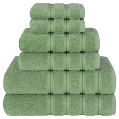 six green towels stacked on top of each other