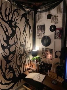 a room that has some kind of art on the wall and is decorated with black and white designs