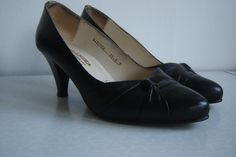 "Shoes are in very good condition. They have been made in Yugoslavia by \"Beograd Centrotextil\" in early 70's, the period which assures great quality. Thick black leather and leather covered heel. Very elegant. Length (sole): 25.5cm or 7in Height (heel): 7cm or 2.7in By purchasing this item you agree to QooQooSVintage shop policies, so please read them: https://www.etsy.com/your/shops/QooQooSVintage/policies ." Vintage Black Leather Shoes, Retro Leather Court Shoes For Evening, Retro Black Leather Court Shoes, Black Retro Leather Court Shoes, Vintage Leather Shoes For Galas, Vintage Black Leather Shoes For Work, Black Retro Court Shoes For Formal Occasions, Retro Black Formal Court Shoes, Vintage Black Leather Court Shoes