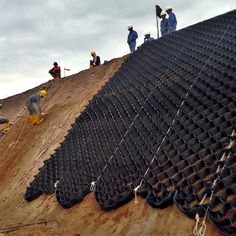 workers are working on the roof of a building that's being constructed into a structure