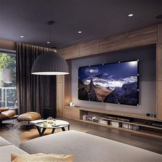 a living room filled with furniture and a large flat screen tv mounted on the wall