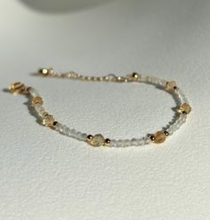 Joy * Positivity * Abundance  - 2mm Citrine beads  - 4mm Citrine beads  - Gold plated  - +2in adjustable chain  Please don't hesitate to contact me if you have any questions!  ☺️ Illuminate your path with our citrine bracelet, a radiant beacon of warmth and optimism. Known for its vibrant golden hues and energizing properties, citrine helps unlock your inner abundance and creativity. Wear this luminous bracelet as a talisman to attract positivity, boost your confidence, and celebrate the joy tha Adjustable Gold Beaded Bracelets With Gemstone, Gold Faceted Beaded Bracelets For Everyday, Minimalist Adjustable Faceted Beaded Bracelets, Adjustable Faceted Beaded Bracelets Minimalist Style, Adjustable Gold Faceted Beaded Bracelet, Faceted Yellow Gold Beaded Bracelets For Everyday, Adjustable Faceted Gold Beaded Bracelet, Delicate Gold Citrine Jewelry, Dainty Yellow Jewelry With Tiny Beads