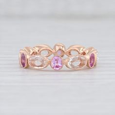 Anniversary Pink Sapphire Ring With Rose Cut Diamonds, Luxury Rose Gold Multi-stone Sapphire Ring, Luxury Multi-stone Rose Gold Sapphire Ring, Luxury Multi-stone Sapphire Ring In Rose Gold, Elegant Multi-stone Pink Sapphire Rings, Elegant Pink Sapphire Eternity Band For Wedding, Anniversary Jewelry With Rose Cut Diamonds And Pink Sapphire, Pink Sapphire Stackable Ring For Wedding, Heirloom Pink Sapphire Jewelry With Prong Setting