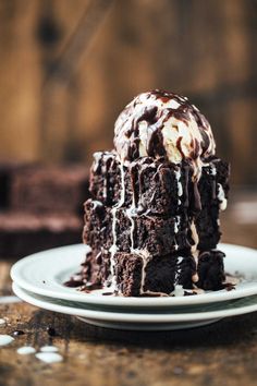 a piece of chocolate cake with ice cream on top