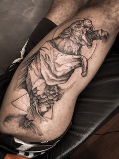 a man with a tattoo on his leg