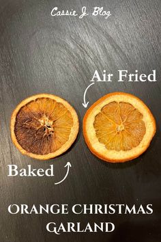 an orange is cut in half and placed on a black surface with the words air fried, baked, orange christmas garland