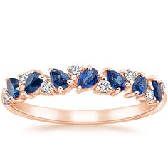 a rose gold ring with blue and white stones