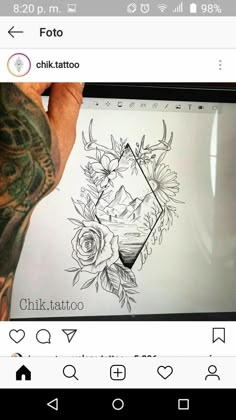 a person holding up a tablet with tattoos on it