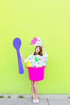 a woman in a ice cream costume holding a spoon