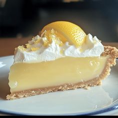 a slice of lemon pie on a white plate