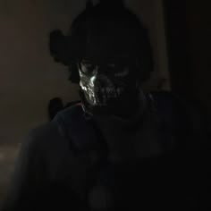 a creepy looking man in the dark with his head turned to look like he is wearing a mask