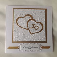 an anniversary card with two hearts on it