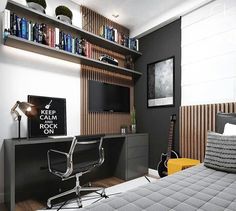 a bedroom with a bed, desk and bookshelf on the wall above it